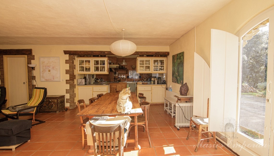 Living room, dining room and kitchen on the ground floor of the farmhouse. 