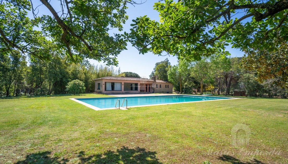 Views of the pool area with the pavilion in the background