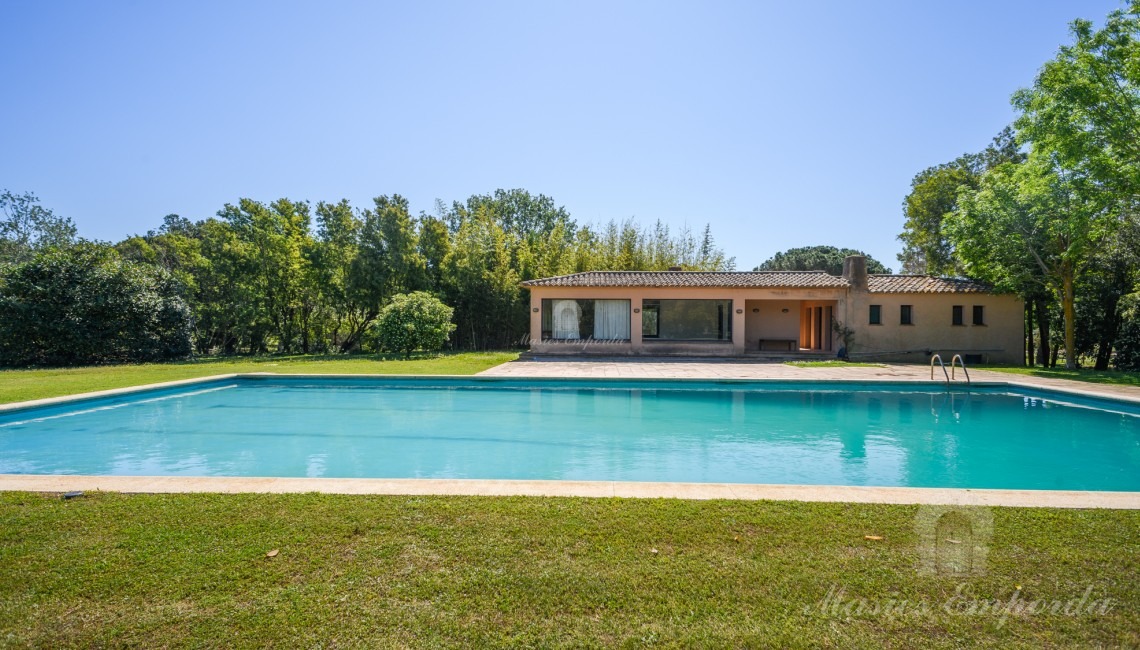 Views of the pool area with the pavilion in the background