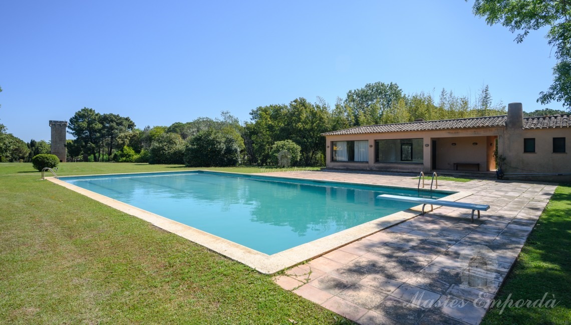 Views of the pool area with the pavilion in the background