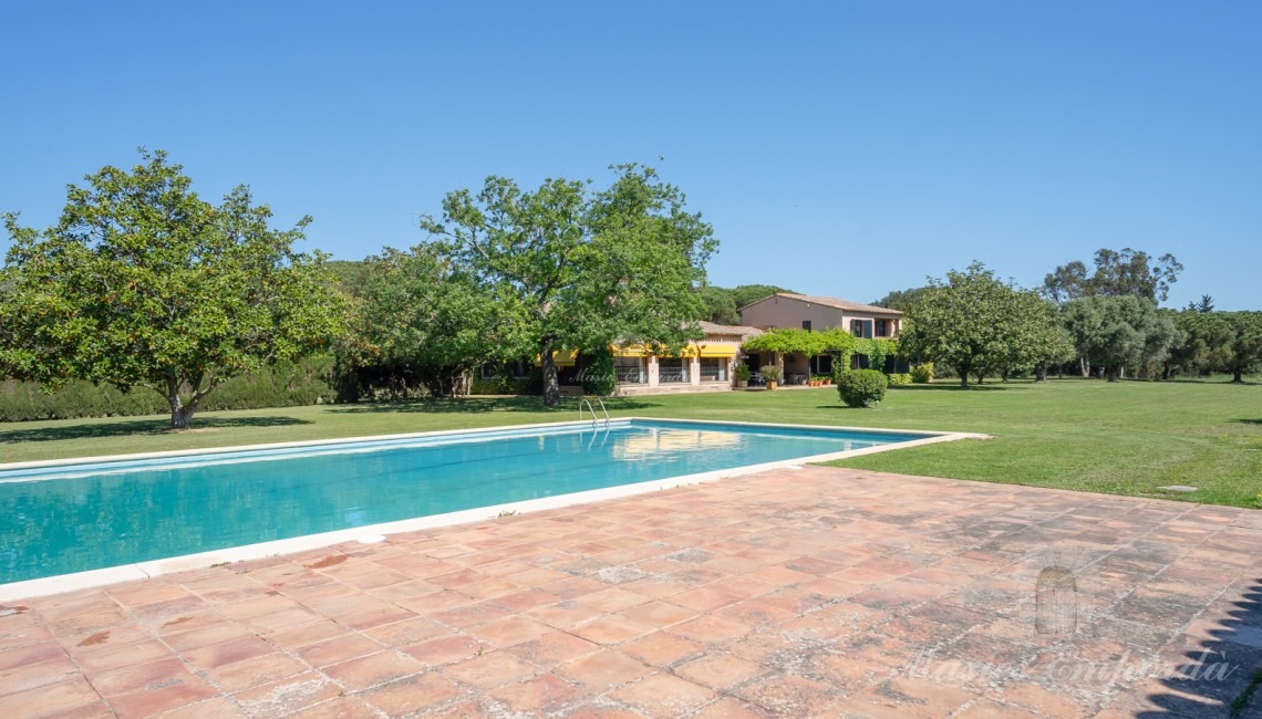 Views of the pool area with the pavilion in the background