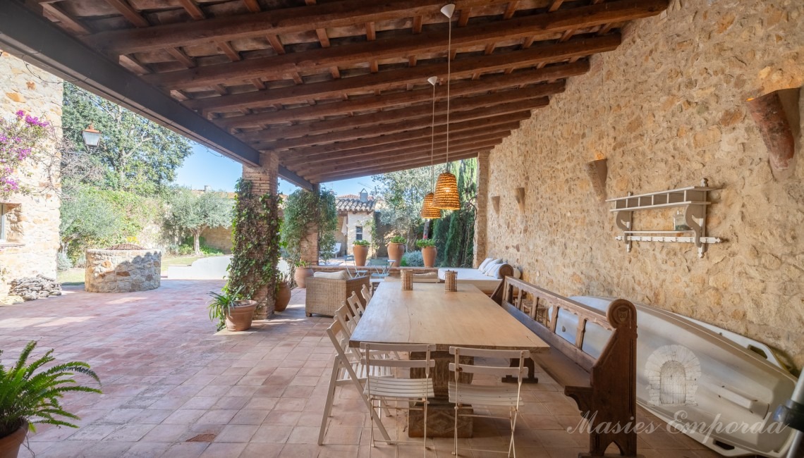 Views of the garden terrace, the summer porches and the swimming pool in the background of the image