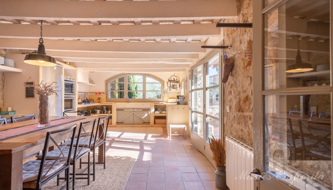 Large kitchen diner overlooking the garden and pool area