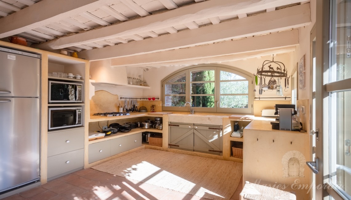 Kitchen overlooking the garden and pool