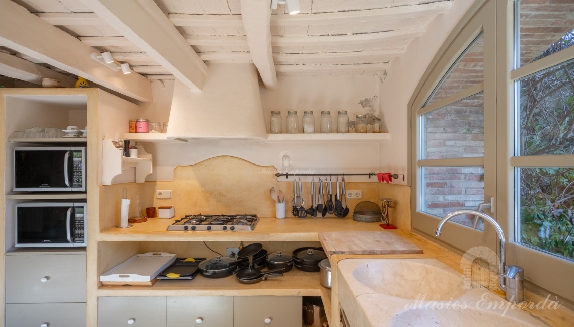 Kitchen overlooking the garden and pool