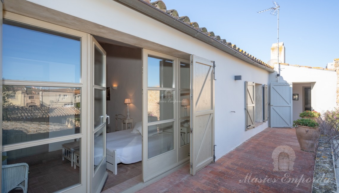 The terrace overlooking the garden and pool 