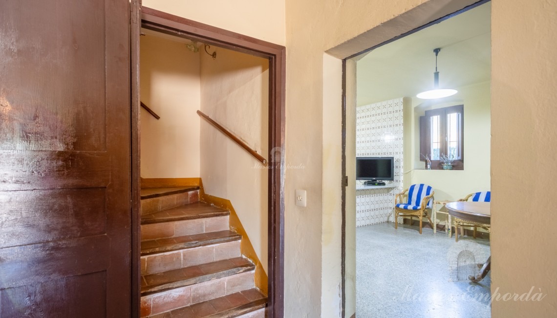 Entrance to the kitchen and staircase leading to floors