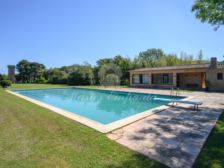 Views of the pool area with the pavilion in the background