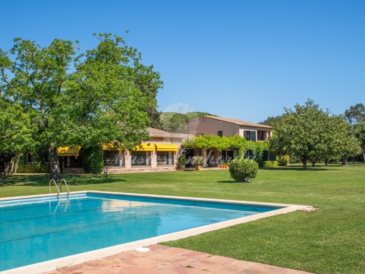 Views of the pool area with the pavilion in the background